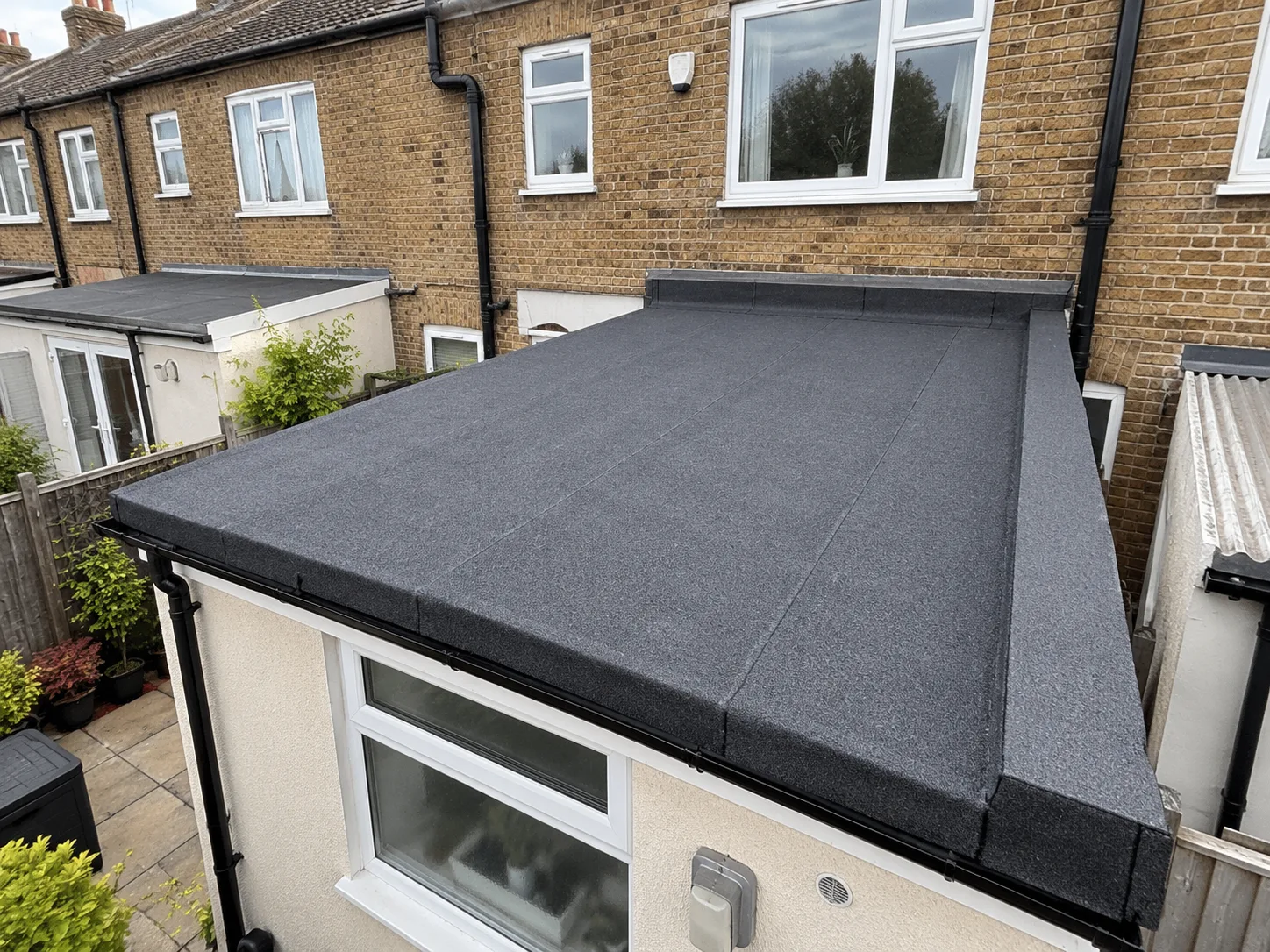 Newly completed flat roof on a terraced house extension